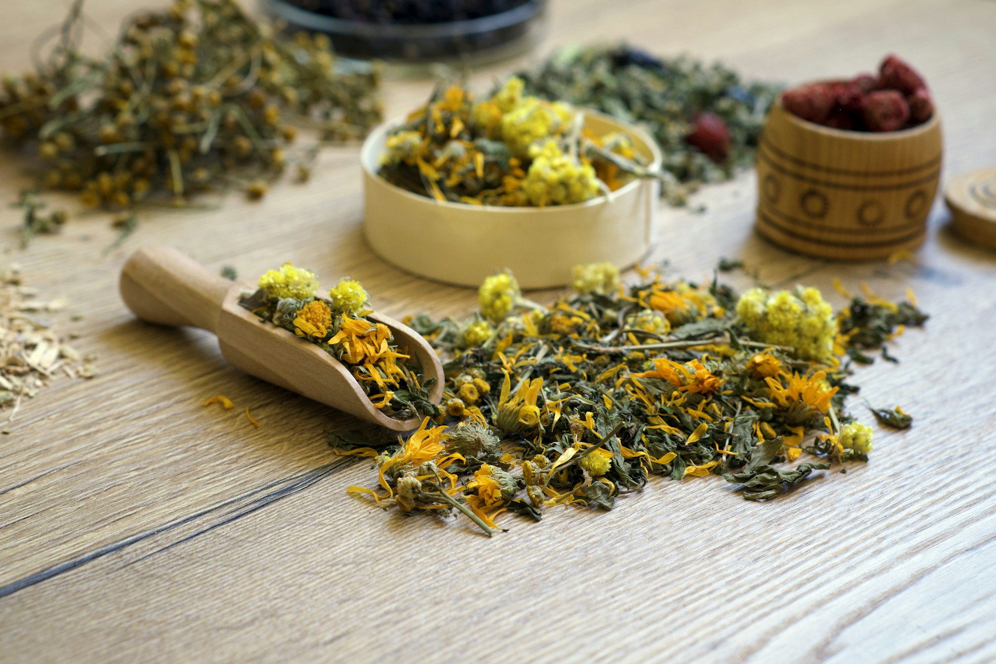 Dry organic ecological herbal tea, berries in a wooden dishes. Antistress, relaxation wellbeing